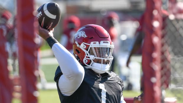 Razorbacks quarterback KJ Jefferson throwing during drills in Wednesday morning's practice